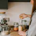 Rental kitchen counter with fermentation jars and cooking ingredients